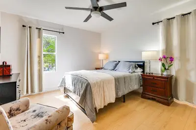 a bedroom with a bed and a ceiling fan at 1 Mi to Rose Bowl! Updated Home with Furnished Deck in Pasadena