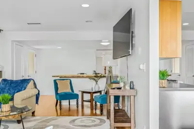 a kitchen and living room with a table and chairs at Summerland Beach Oasis- Pet Friendly in Summerland