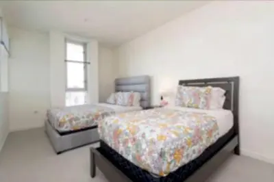 a bedroom with two beds and a window at Stunning 2BR Penthouse Patio & View Venice MDR in Los Angeles
