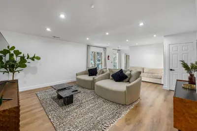 a living room with a couch and a table at THE Cabin in Running Springs