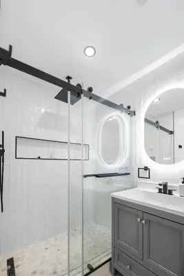 a bathroom with a glass shower and a sink at THE Cabin in Running Springs