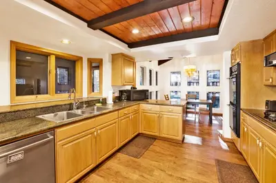 a kitchen with wooden cabinets and a counter top at The Birdhouse #2529 in Big Bear Lake