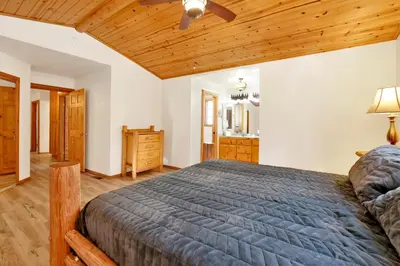 a bedroom with a bed and a wooden ceiling at Oriole House #2518 in Big Bear Lake