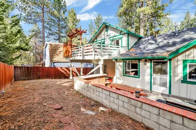 a house being built with a retaining wall at Green Squirrel Chateau #2484 in Big Bear Lake