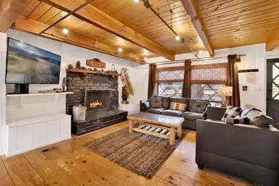 a living room with a couch and a fireplace at Camp Conklin #2337 in Big Bear Lake