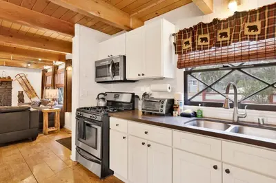 a kitchen with a stove and a sink at Camp Conklin #2337 in Big Bear Lake