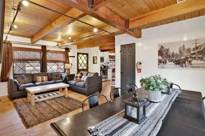 a living room with a table and a couch at Camp Conklin #2337 in Big Bear Lake