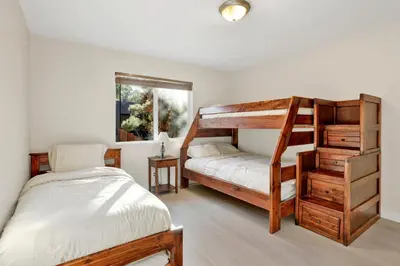 a bedroom with two bunk beds and a bed at Temple Bear Chalet #2507 in Big Bear Lake