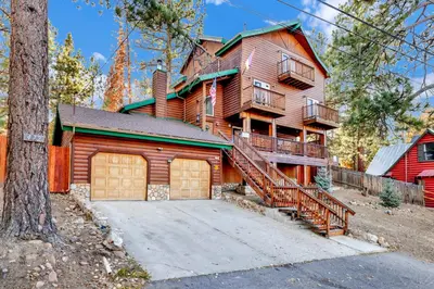 a large wooden house with a garage at Temple Bear Chalet #2507 in Big Bear Lake