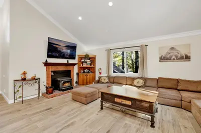 a living room with a couch and a fireplace at Temple Bear Chalet #2507 in Big Bear Lake