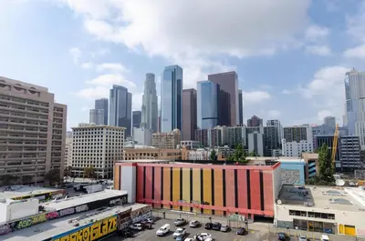 a view of a city skyline with buildings at Lovely 3BR Apt With Balcony And Rooftop Pool Plus Views in Los Angeles