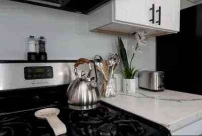 a tea kettle sitting on top of a stove in a kitchen at Charming 2BR Condo with Onsite Parking Included in Los Angeles