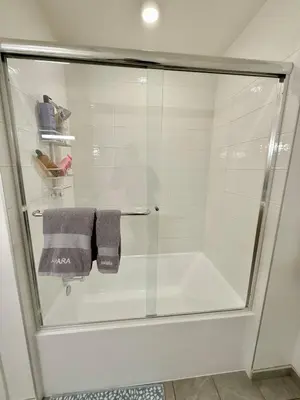 a bathroom with a shower with a glass door at Top Floor Hollywood 1BR Condo with Views in Los Angeles