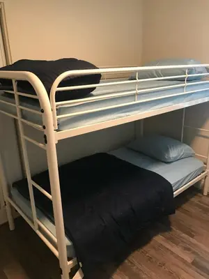 a couple of bunk beds in a room at VWM Hostel in Los Angeles