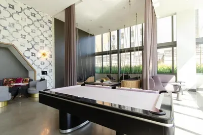 a large billiard room with a pool table at Stunning 3 Bedroom High-Rise with Pool, Spa, and Rooftop Views in Los Angeles