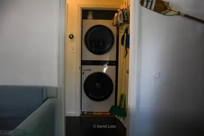 two washers and a dryer in a closet at Cozy and Relaxing in Suburbs of LA in Mission Hills