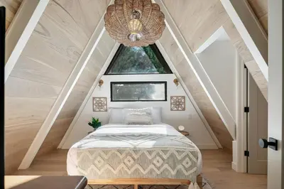 a bedroom with a bed in a attic at Studio City Stunning House with 5 bedrooms, Pool, Jacuzzi, Fire-pit, Guest House in Studio City