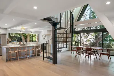 a kitchen and dining room with a staircase in a house at Studio City Stunning House with 5 bedrooms, Pool, Jacuzzi, Fire-pit, Guest House in Studio City