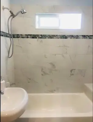 a bathroom with a sink and a tub and a toilet at 4bed 2ba Hollywood house Block away from sunset, Free parking, private backyard in Los Angeles