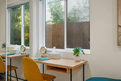 a room with a table and two chairs and a window at NEW Koreatown l Universal Studios in Vernon