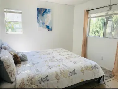 a bedroom with a bed and a window at 4bed 2ba Hollywood house Block away from sunset, Free parking, private backyard in Los Angeles