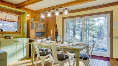 a dining room with a table and chairs in a kitchen at Lakefront w Private Dock Hot Tub Large Deck Views Lakeside on Lagunita in Big Bear Lake