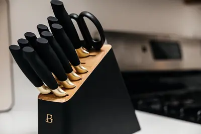 a group of knives in a black knife block at Seaside Serenity - Chic Santa Monica Studio in Los Angeles