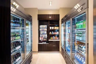 a grocery store aisle with bottles of alcohol at SpringHill Suites by Marriott Los Angeles Burbank/Downtown in Burbank
