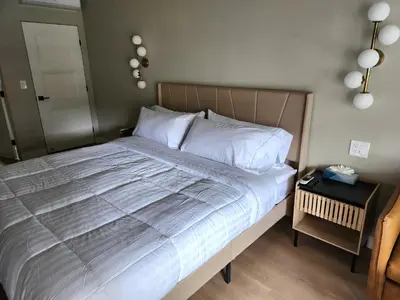 a bedroom with a large bed with white pillows at Studio 9 Big Bear Lake in Big Bear Lake