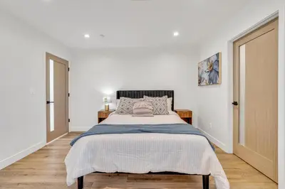 a white bedroom with a large bed in it at Luxe Townhome Newly-Built in Sherman Oaks Community Hospital Heliport