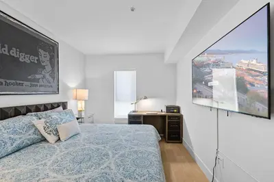 a bedroom with a bed and a large window at 8 Santa Monica Huge Stylish Apartment in Los Angeles