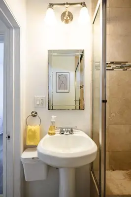 a bathroom with a sink and a mirror at Comfortable Home Near LA with Full Kitchen & Laundry in Alhambra