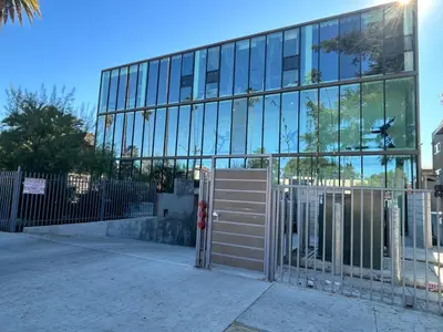 a gate in front of a glass building at New Lux Skyline Loft in LA in North Sherman Way