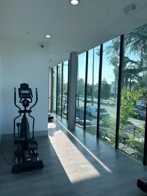 a camera on a tripod in a room with windows at New Lux Skyline Loft in LA in North Sherman Way