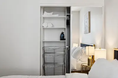 a bedroom with a closet with a mirror and a bed at 2BDR Home Away From Home in Marina del Rey in Los Angeles