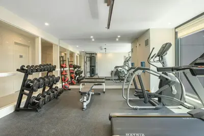 a gym with treadmills and machines in a room at Relaxing space in Palos Verdes in Rancho Palos Verdes