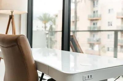 a white desk with a chair in front of a window at Magnificent two bedroom in West Hollywood in Los Angeles