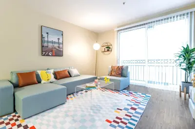 a living room with a couch and a table at Marina del Rey 1bdr Retreat with pool, gym, free parking in Los Angeles