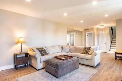a living room with a couch and a table at Spacious 4BR Retreat near Disneyland & Beaches in Placentia