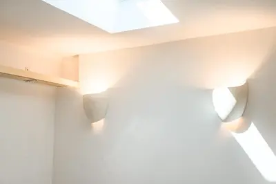 a room with white walls and lights on the ceiling at Scenic Retreat with Deck & Stunning Views in LA in Glendale