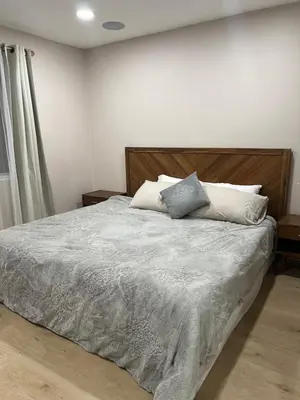a bedroom with a bed with two pillows on it at Luxury Home LA Big Bear & LV 5 Mins to Mall in Victorville