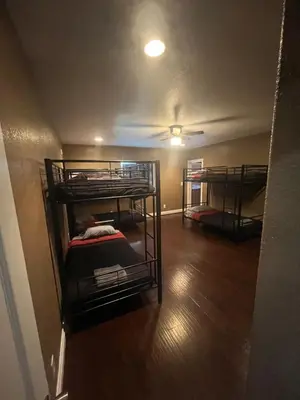 a room with three bunk beds in a room at Cultura Homes On Crawford in Los Angeles