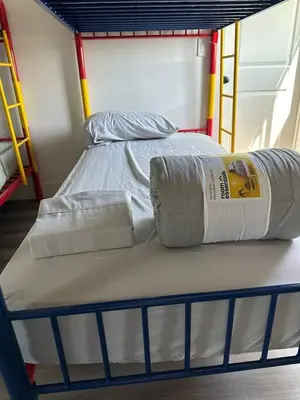 a bunk bed with two pillows on top of it at Cultura Homes On Crawford in Los Angeles