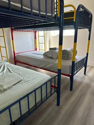 a couple of bunk beds in a room at Cultura Homes On Crawford in Los Angeles