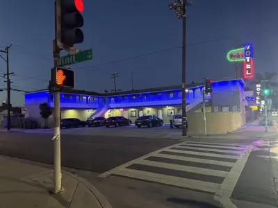 a traffic light on the corner of a street at night at Bob's Motel in Commerce
