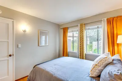 a bedroom with a bed and a window at 2 Mi to Griffith Park Chic Home with Private Patio in Burbank