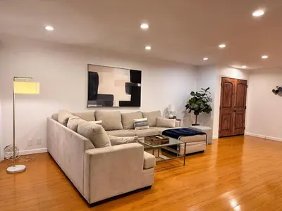 a living room with a couch and a table at Coastal haven retreat in Los Angeles