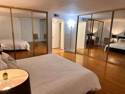 a hotel room with a bed and a mirror at Coastal haven retreat in Los Angeles