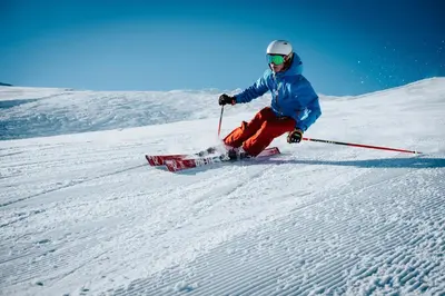 a person is skiing down a snow covered slope at Contemporary Classic on a Private Mountain Lake in Lake Arrowhead