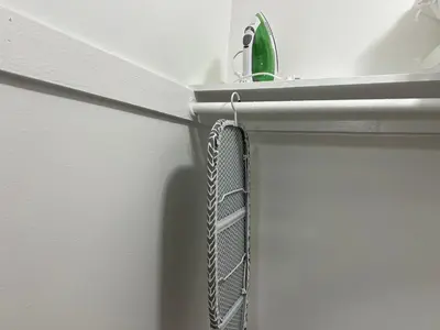 a shelf with a chain hanging from a wall at NoHo Cozy Cove in Burbank